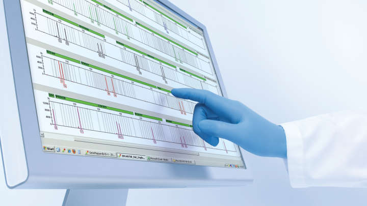 Monitor screen with data and hand