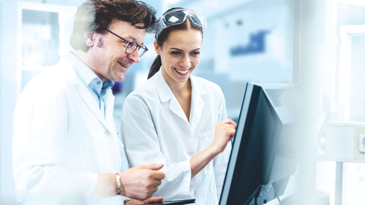 people in lab smiling