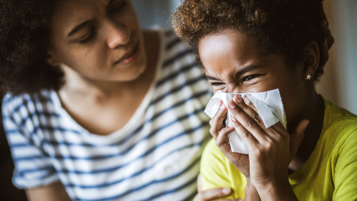 mother taking care over a sick child, motherhood, sneeze, infection, disease, Cough, RSV, COVID-19