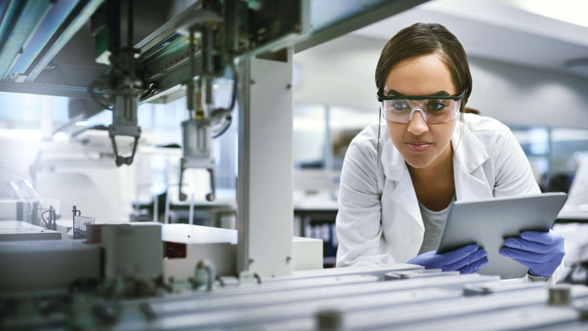 Female scientist watching an instrument