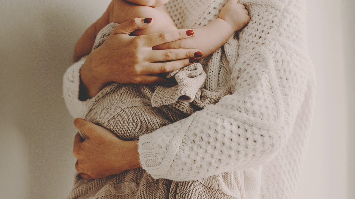 Mother holding her baby, cosy, mom, woman, close up