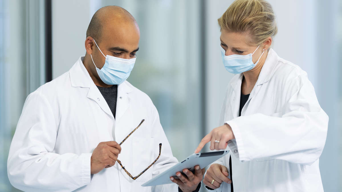 Two scientist discussing results outside the laboratory