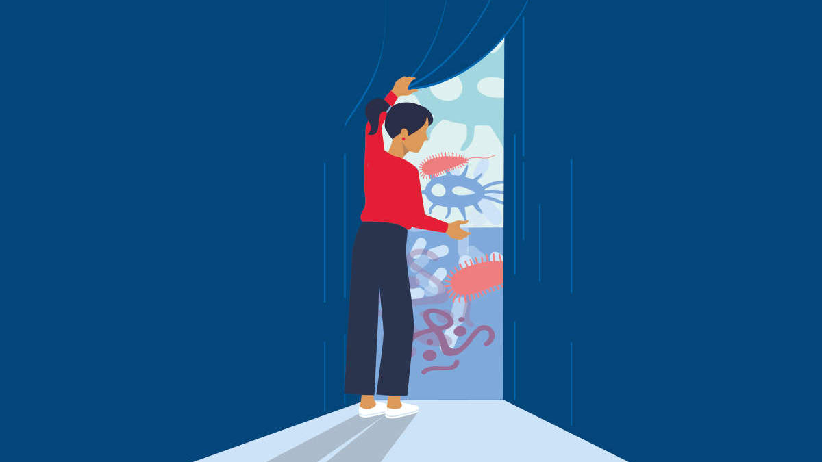 Woman opening curtain