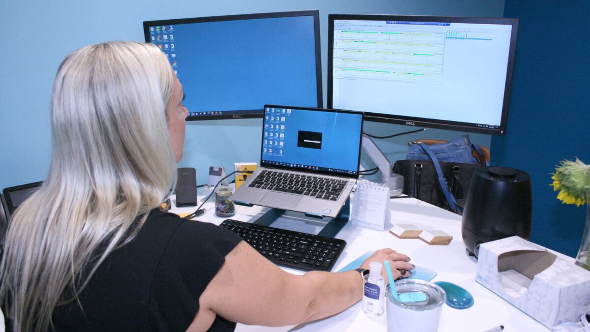 Rachel Oefelein, chief scientific officer, in her office at DNA Labs International, checking a DNA sequence, data, analysis